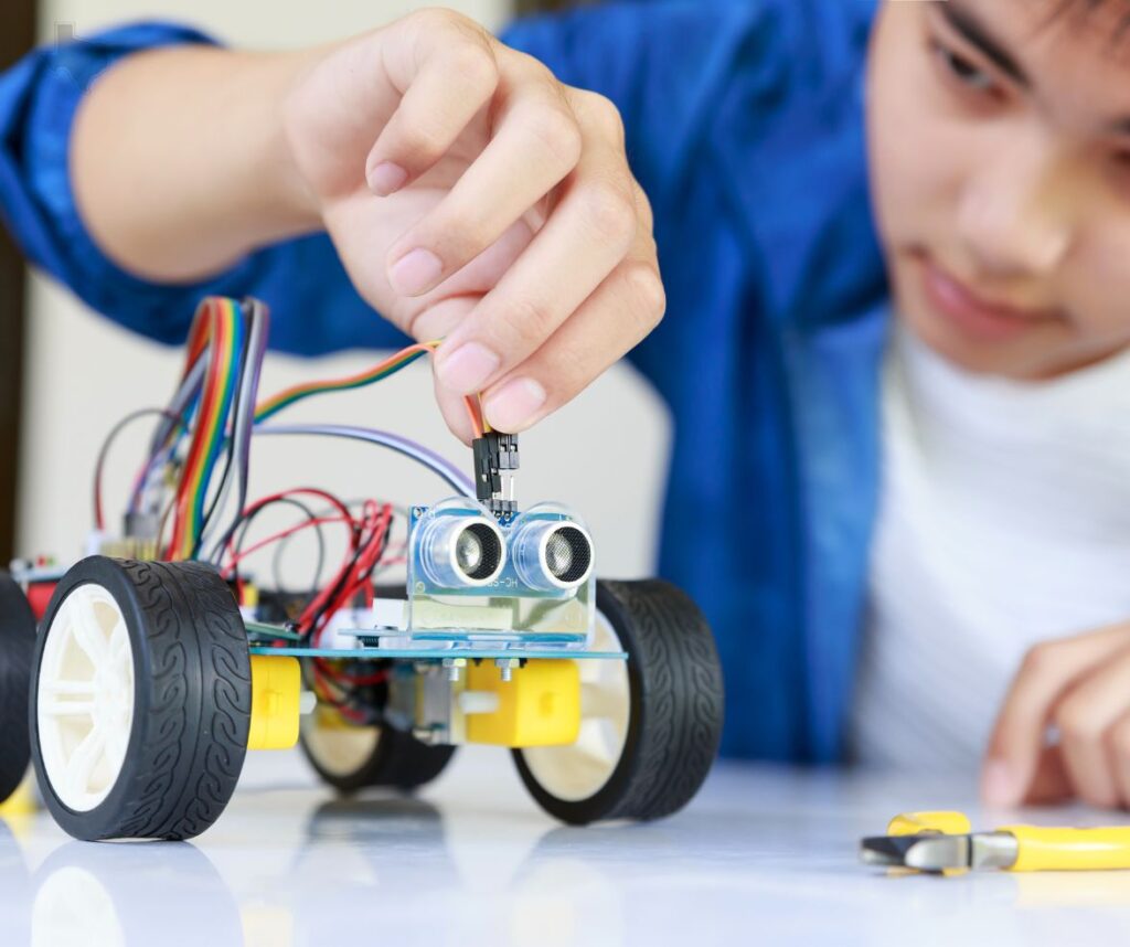 STEM student building robot.