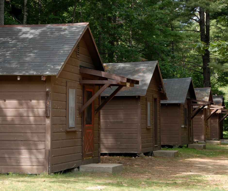 A cluster of brown houses, showcasing economical summer camp facilities in and near DFW.