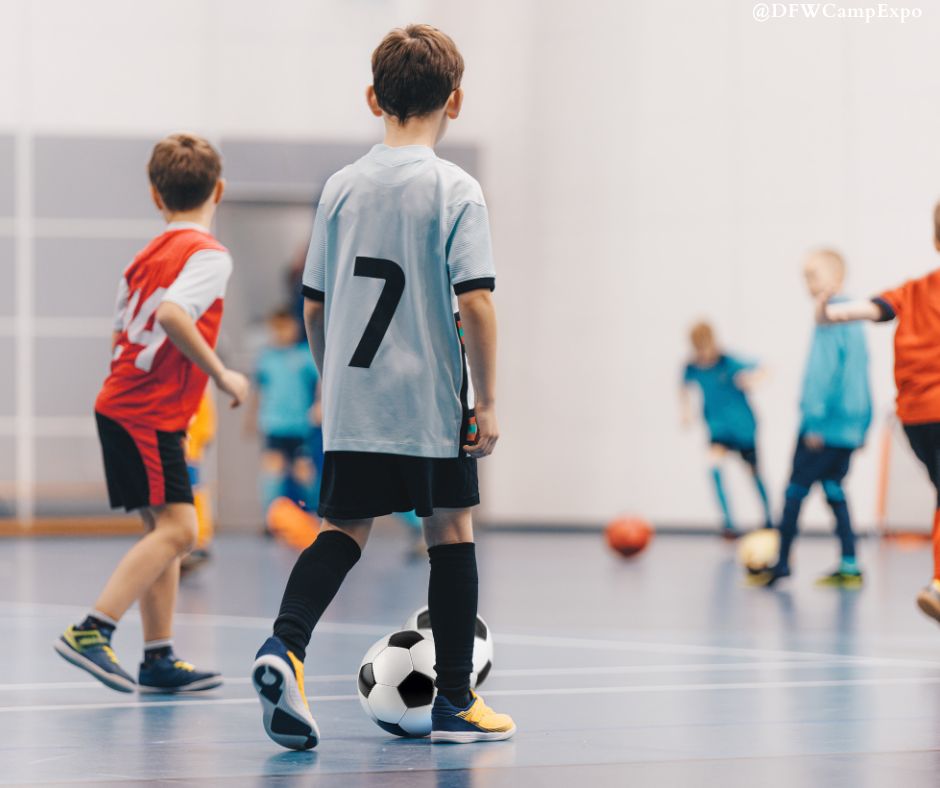 Kids actively participating in a soccer game within an indoor gym, emphasizing the fun of exploring Futsal in DFW.