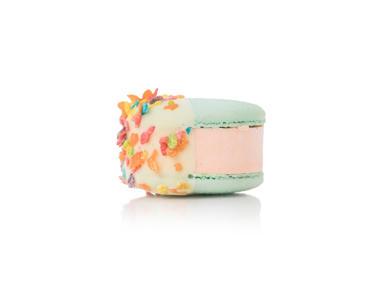 A vibrant macaron topped with colorful sprinkles, showcasing a delightful treat from one of Fort Worth's best ice cream shops.