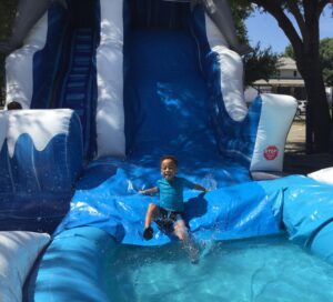 Alpha Omega Gymnastics water slide at summer camp